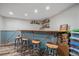 Basement bar with wooden counter and space for seating at 4320 Teller St, Wheat Ridge, CO 80033