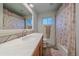 Updated bathroom featuring a large vanity and tiled shower at 4320 Teller St, Wheat Ridge, CO 80033