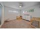 Bedroom featuring carpeted floors, white walls, and plenty of natural light at 4320 Teller St, Wheat Ridge, CO 80033
