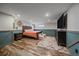 Finished basement featuring a bedroom with wood style flooring at 4320 Teller St, Wheat Ridge, CO 80033