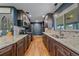 Modern kitchen features wooden floors, granite countertops and updated appliances at 4320 Teller St, Wheat Ridge, CO 80033