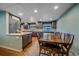 Eat-in kitchen featuring an island and seating for eight at 4320 Teller St, Wheat Ridge, CO 80033