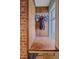 Mudroom entry area with wooden wall and hooks by a window at 4320 Teller St, Wheat Ridge, CO 80033