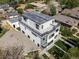 Aerial view of modern home featuring rooftop deck and surrounding neighborhood at 1543 Glencoe St, Denver, CO 80220