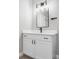 Modern bathroom featuring a white vanity and matte black hardware and fixtures at 1543 Glencoe St, Denver, CO 80220