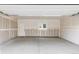 Unfinished three car garage interior with white walls and a concrete floor ready for customization at 1543 Glencoe St, Denver, CO 80220