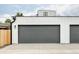 Spacious three-car garage with modern doors offers ample parking and storage at 1543 Glencoe St, Denver, CO 80220