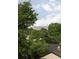 The snow capped mountains can be seen above the lush green trees in this picturesque view at 1543 Glencoe St, Denver, CO 80220