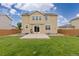 Spacious backyard with a concrete patio and a relaxing hanging chair at 2510 E 160Th Pl, Thornton, CO 80602