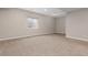 Well-lit basement with neutral walls, carpet flooring, and a window for natural light at 2510 E 160Th Pl, Thornton, CO 80602