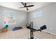 Bright bedroom with carpeted floors, a ceiling fan, and windows bringing in plenty of natural light at 2510 E 160Th Pl, Thornton, CO 80602