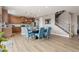 Open concept dining room with wood floors next to the kitchen and staircase at 2510 E 160Th Pl, Thornton, CO 80602