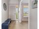Inviting entryway with sleek floors, neutral walls, and ample natural light at 2510 E 160Th Pl, Thornton, CO 80602