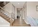 Welcoming entryway with wood floors, a staircase, and a view into the home at 2510 E 160Th Pl, Thornton, CO 80602