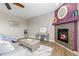 Inviting living room featuring a cozy fireplace and comfortable seating, perfect for relaxing at 2510 E 160Th Pl, Thornton, CO 80602