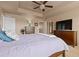 Spacious main bedroom featuring a ceiling fan, warm neutral tones, and plush carpet at 2510 E 160Th Pl, Thornton, CO 80602