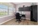 Bright office space with a window, desk, and modern furniture at 2510 E 160Th Pl, Thornton, CO 80602