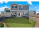 Landscaped backyard featuring a well-maintained lawn and rock features at 4419 N Quatar Ct, Aurora, CO 80019