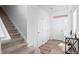 Bright entryway with tile floors, white walls and a staircase leading to the upper level at 4419 N Quatar Ct, Aurora, CO 80019