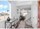 Bright entryway with hardwood floors, a console table, and a view into the living area at 4419 N Quatar Ct, Aurora, CO 80019