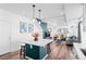Open floor plan with kitchen island open to the living room and staircase at 4419 N Quatar Ct, Aurora, CO 80019