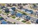 Aerial view showcasing a neighborhood homes with solar panels and well-maintained front yard at 5659 Viewpoint Ave, Firestone, CO 80504