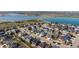 Aerial view showcasing a neighborhood with a beautiful lake in the background at 5659 Viewpoint Ave, Firestone, CO 80504