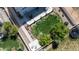Aerial view of the backyard with mature landscaping, patio with seating, and a manicured lawn at 5659 Viewpoint Ave, Firestone, CO 80504