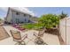 Spacious backyard with patio seating, grassy lawn, privacy fence and mature trees at 5659 Viewpoint Ave, Firestone, CO 80504