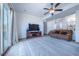 Spacious living room with a large sliding door, contemporary furnishings, and ample natural light at 5659 Viewpoint Ave, Firestone, CO 80504