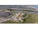 Aerial view highlighting a park with a playground, set against a backdrop of future development at 5659 Viewpoint Ave, Firestone, CO 80504