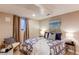 Basement bedroom with soft lighting, a window, and a stylish bed and decor at 8370 E Princeton Ave, Denver, CO 80237