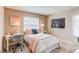 Cozy bedroom features a comfortable bed, stylish decor, and a peaceful ambiance at 8370 E Princeton Ave, Denver, CO 80237