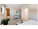 Serene bedroom with a peek into the bathroom, neutral tones, and ample closet space at 8370 E Princeton Ave, Denver, CO 80237