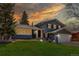 Charming two-story home featuring a landscaped front yard and attached two-car garage at 8370 E Princeton Ave, Denver, CO 80237