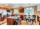 Modern kitchen with stainless steel appliances, granite countertops, and an island with seating at 8370 E Princeton Ave, Denver, CO 80237