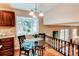 Cozy breakfast nook near kitchen featuring a glass table and bay window with natural light at 8370 E Princeton Ave, Denver, CO 80237