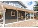 Covered patio with outdoor seating and a view of the backyard at 8370 E Princeton Ave, Denver, CO 80237