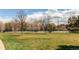 Scenic view of a community tennis court surrounded by lush greenery at 8370 E Princeton Ave, Denver, CO 80237