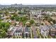 Urban neighborhood showcasing diverse architecture, mature trees, and distant city skyline views at 1302 N Stuart St, Denver, CO 80204