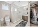 Modern bathroom featuring a glass-enclosed shower, stylish vanity, and neutral color palette at 1302 N Stuart St, Denver, CO 80204