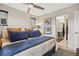 Bedroom with a comfortable bed, modern furnishings, and an ensuite bathroom at 1302 N Stuart St, Denver, CO 80204