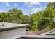 A view from the roof of the city skyline surrounded by mature trees at 1302 N Stuart St, Denver, CO 80204