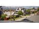 An exterior street view of modern homes with mountain views in the background at 1302 N Stuart St, Denver, CO 80204