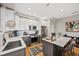Modern kitchen features stainless steel appliances, white countertops, and a breakfast bar at 1302 N Stuart St, Denver, CO 80204
