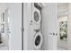 Efficient laundry closet with stacked washer and dryer units, maximizing space at 1302 N Stuart St, Denver, CO 80204