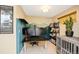 Functional home office space with desk, wall art, and natural light at 1302 N Stuart St, Denver, CO 80204