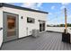 Stylish rooftop deck with string lights, modern railings, and views at 1302 N Stuart St, Denver, CO 80204