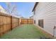 Small backyard with fenced-in area and grass at 10731 W 63Rd Ave # A, Arvada, CO 80004