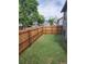 Fenced backyard with a fresh green lawn, offering privacy and a great space for outdoor activities at 10731 W 63Rd Ave # A, Arvada, CO 80004